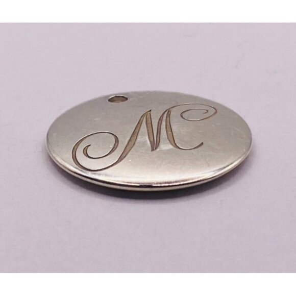 Tiffany & Co. Silver Alphabet Large Disc letter Initial  Tiffany & Co. Sterling Silver Notes Alphabet Letter M Large Disc Charm Pendant
